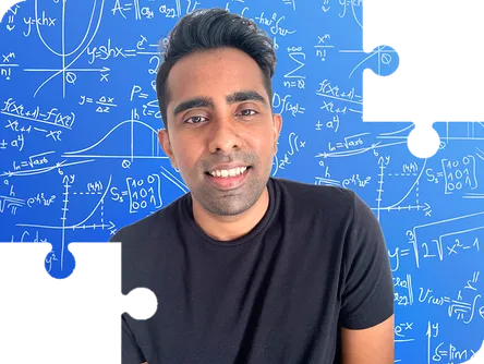 Dilosan smiling in front of a whiteboard, framed by puzzle pieces