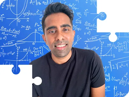 Dilosan smiling in front of a whiteboard, framed by puzzle pieces
